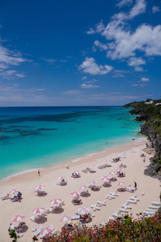 Aerial view of the beach, with beach chairs and umbrellas, at The Reefs Resort & Club in Bermuda